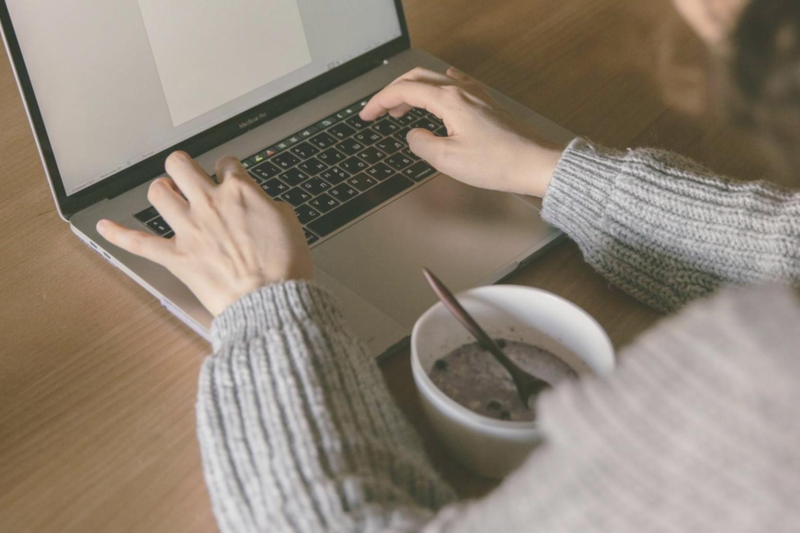 Students collaborating on mobile game project during hands-on workshop session