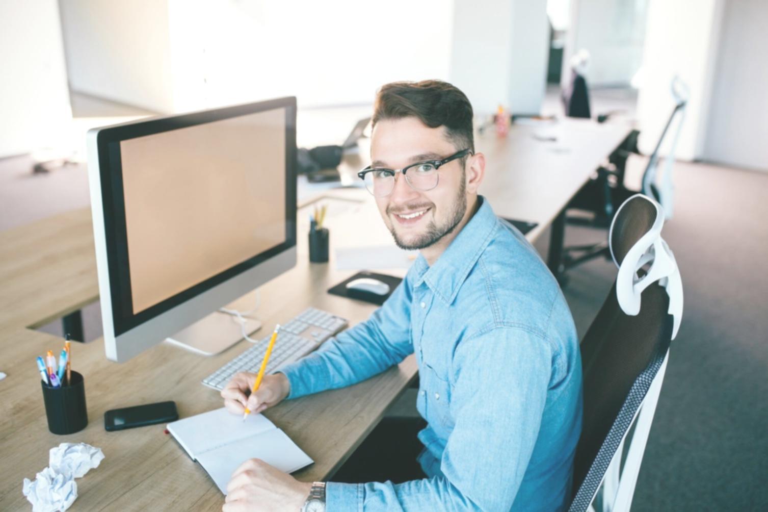 Student collaboration during mobile game development workshop at Oymnex training facility